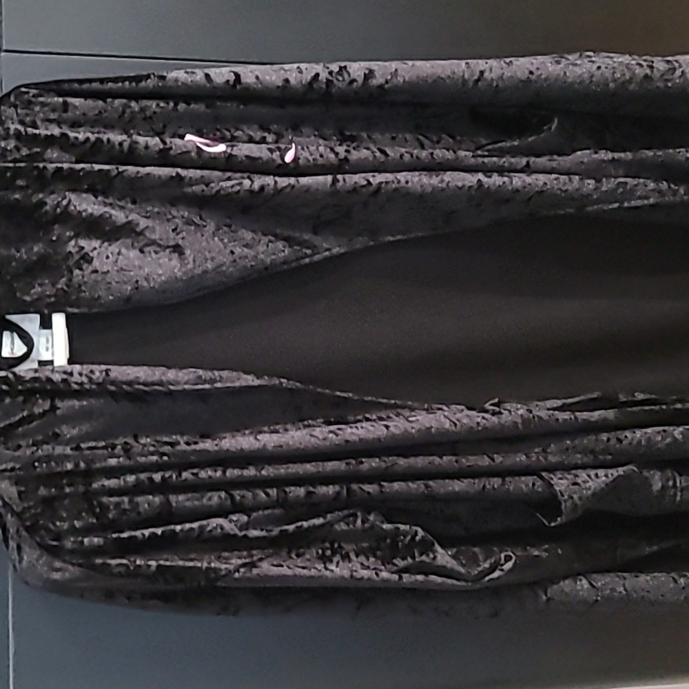 A black robe with the initial "J"